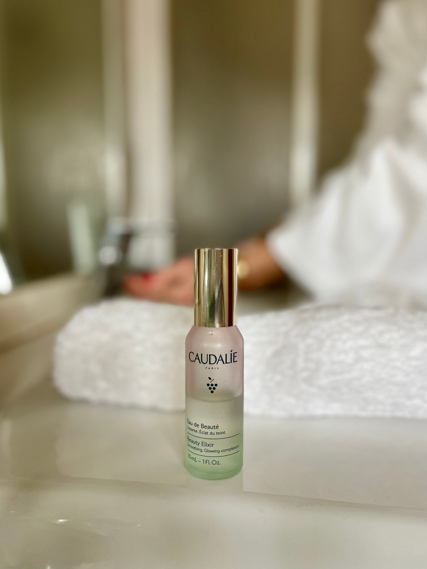 UGC created photography showing a beauty spray from Caudalie in a minimalist bathroom setting